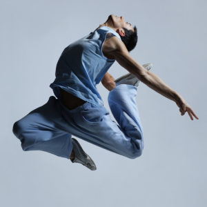 man wearing blue jumping