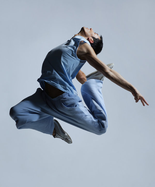 man wearing blue jumping