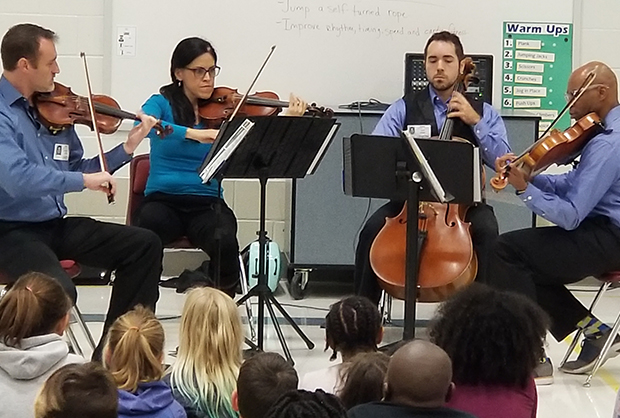 brazos valley orchestra performing at school